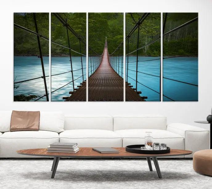 A breathtaking 3-panel nature photography piece titled "Suspension Bridge Over River Canvas Art" beautifully enhances the living room wall, adding an exquisite touch of scenic wall art.