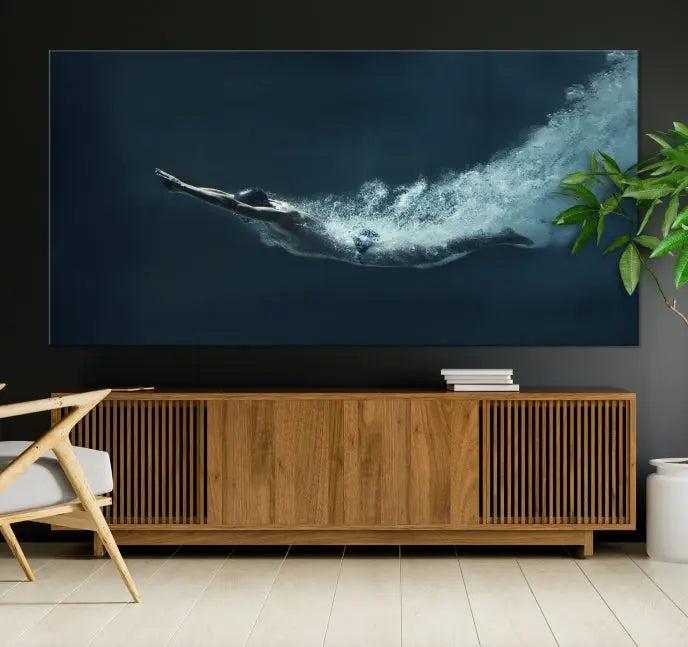 A set of three "Swimmer Wall Art Canvas Print" pieces enhances the wall. These gallery-wrapped artworks are printed on museum-quality canvas and are treated with a UV-protective coating for enduring vibrancy.