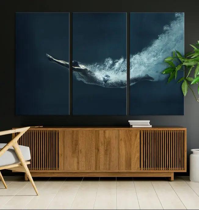 A set of three "Swimmer Wall Art Canvas Print" pieces enhances the wall. These gallery-wrapped artworks are printed on museum-quality canvas and are treated with a UV-protective coating for enduring vibrancy.