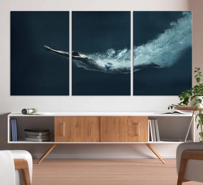 A set of three "Swimmer Wall Art Canvas Print" pieces enhances the wall. These gallery-wrapped artworks are printed on museum-quality canvas and are treated with a UV-protective coating for enduring vibrancy.