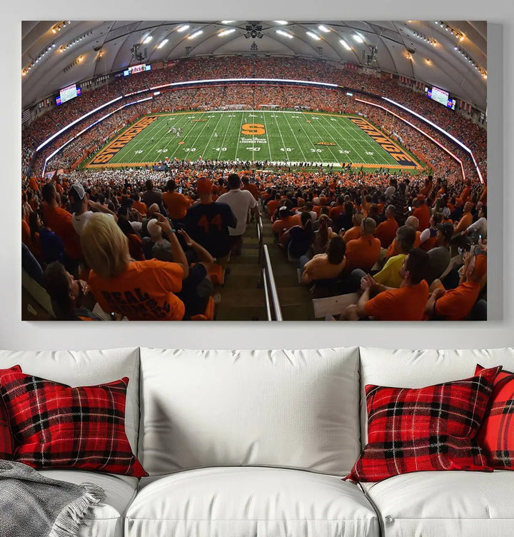 The Syracuse University Orange Football Team Print is a canvas wall art of the Syracuse JMA Wireless Dome, beautifully resembling a packed stadium with fans in orange and capturing the energy of the moment with a gallery-quality finish.