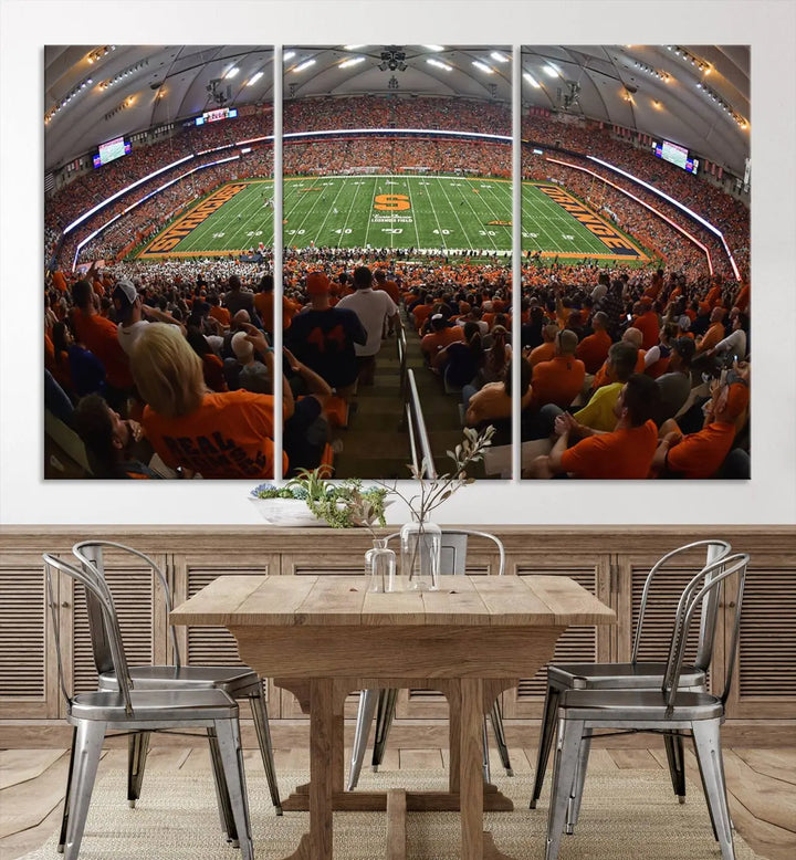 The Syracuse University Orange Football Team Print is a canvas wall art of the Syracuse JMA Wireless Dome, beautifully resembling a packed stadium with fans in orange and capturing the energy of the moment with a gallery-quality finish.