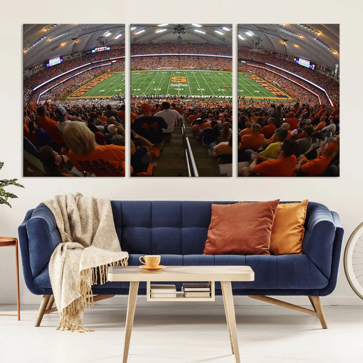 The Syracuse University Orange Football Team Print is a canvas wall art of the Syracuse JMA Wireless Dome, beautifully resembling a packed stadium with fans in orange and capturing the energy of the moment with a gallery-quality finish.