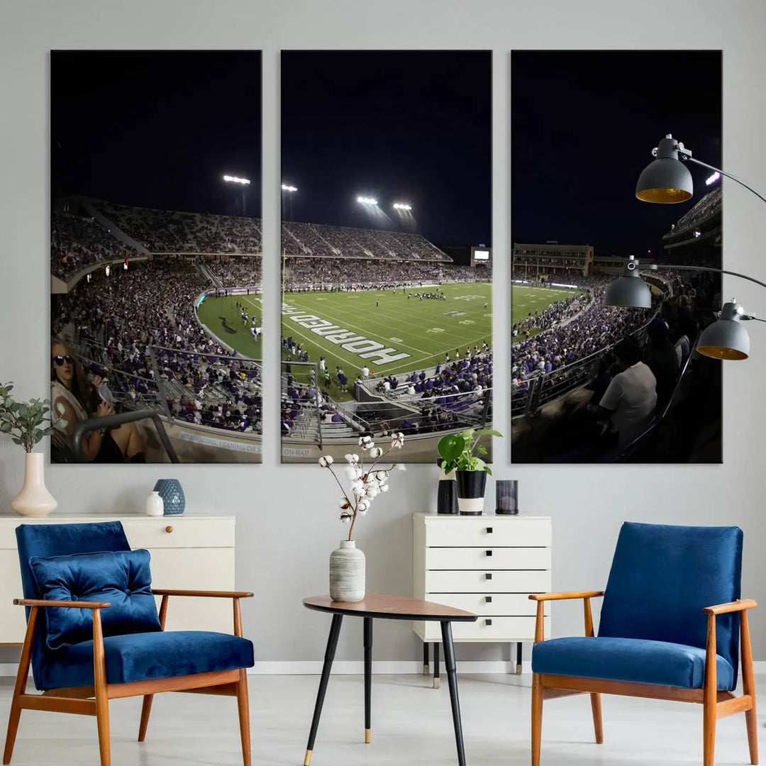 Immerse yourself in the vibrant energy of a packed football stadium at night with bright lights illuminating the field and stands, beautifully captured in the TCU Horned Frogs Football Team Print on premium canvas. This wall art features Fort Worth's Amon G. Carter Stadium.