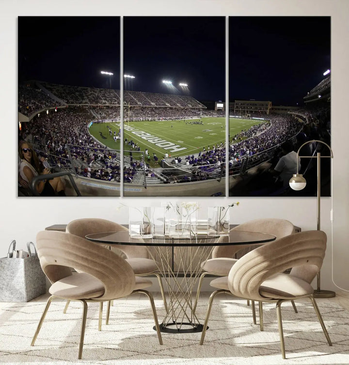 Immerse yourself in the vibrant energy of a packed football stadium at night with bright lights illuminating the field and stands, beautifully captured in the TCU Horned Frogs Football Team Print on premium canvas. This wall art features Fort Worth's Amon G. Carter Stadium.