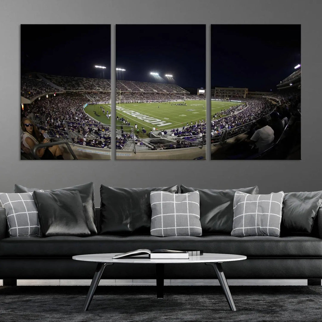 Immerse yourself in the vibrant energy of a packed football stadium at night with bright lights illuminating the field and stands, beautifully captured in the TCU Horned Frogs Football Team Print on premium canvas. This wall art features Fort Worth's Amon G. Carter Stadium.