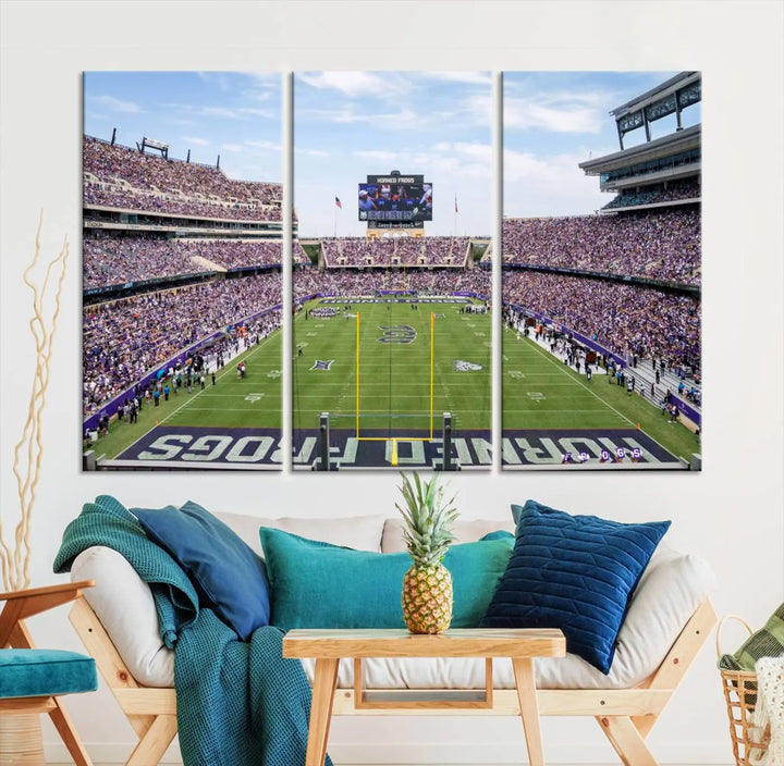 The living room showcases a triptych canvas artwork titled "TCU Horned Frogs Football Team Print - Fort Worth Amon G. Carter Stadium Wall Art Canvas Print," depicting a bustling football stadium and field under a clear blue sky in a gallery-quality finish.