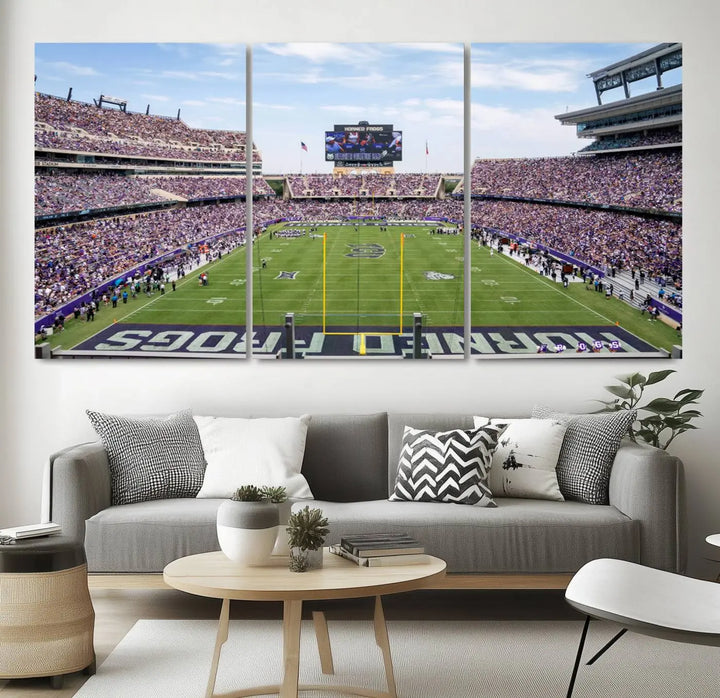 The living room showcases a triptych canvas artwork titled "TCU Horned Frogs Football Team Print - Fort Worth Amon G. Carter Stadium Wall Art Canvas Print," depicting a bustling football stadium and field under a clear blue sky in a gallery-quality finish.