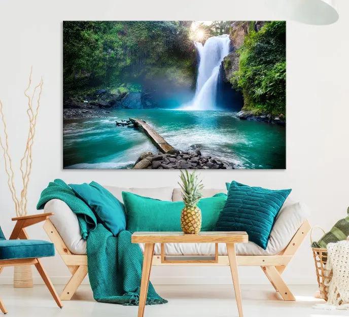 The "Tegenungan Waterfall" artwork, a serene scene printed on museum-quality polycotton canvas, decorates the living room. This UV-protective, ready-to-hang art piece is displayed gracefully above the sofa.