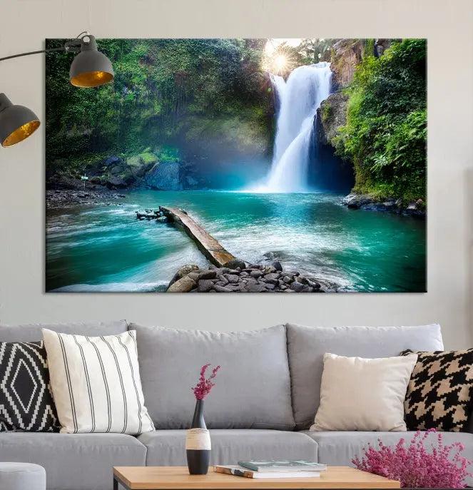 The "Tegenungan Waterfall" artwork, a serene scene printed on museum-quality polycotton canvas, decorates the living room. This UV-protective, ready-to-hang art piece is displayed gracefully above the sofa.