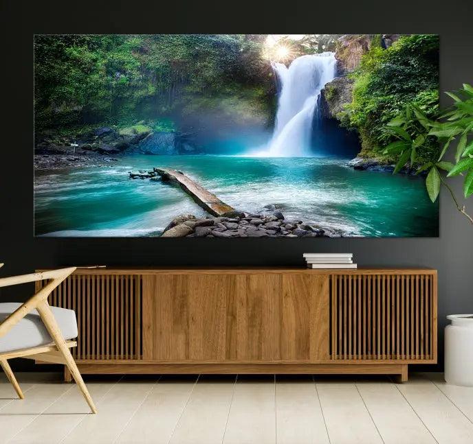 The "Tegenungan Waterfall" artwork, a serene scene printed on museum-quality polycotton canvas, decorates the living room. This UV-protective, ready-to-hang art piece is displayed gracefully above the sofa.