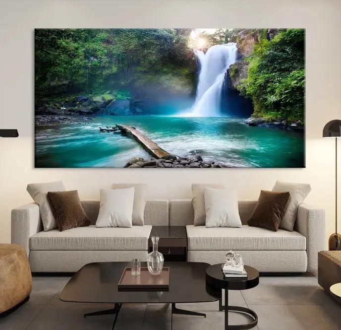 The "Tegenungan Waterfall" artwork, a serene scene printed on museum-quality polycotton canvas, decorates the living room. This UV-protective, ready-to-hang art piece is displayed gracefully above the sofa.