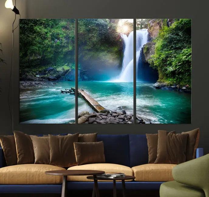 The "Tegenungan Waterfall" artwork, a serene scene printed on museum-quality polycotton canvas, decorates the living room. This UV-protective, ready-to-hang art piece is displayed gracefully above the sofa.