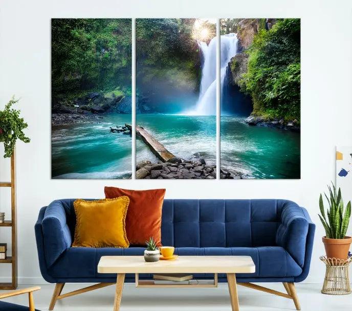 The "Tegenungan Waterfall" artwork, a serene scene printed on museum-quality polycotton canvas, decorates the living room. This UV-protective, ready-to-hang art piece is displayed gracefully above the sofa.