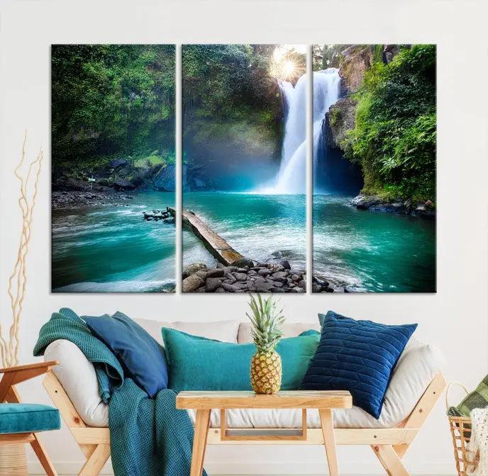 The "Tegenungan Waterfall" artwork, a serene scene printed on museum-quality polycotton canvas, decorates the living room. This UV-protective, ready-to-hang art piece is displayed gracefully above the sofa.