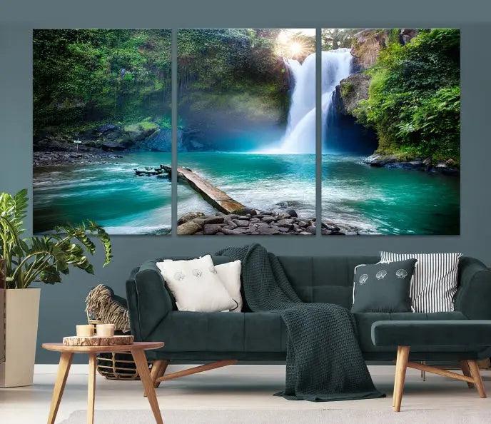 The "Tegenungan Waterfall" artwork, a serene scene printed on museum-quality polycotton canvas, decorates the living room. This UV-protective, ready-to-hang art piece is displayed gracefully above the sofa.