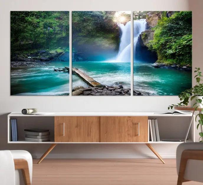 The "Tegenungan Waterfall" artwork, a serene scene printed on museum-quality polycotton canvas, decorates the living room. This UV-protective, ready-to-hang art piece is displayed gracefully above the sofa.