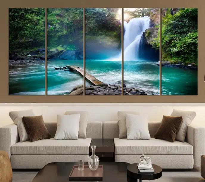 The "Tegenungan Waterfall" artwork, a serene scene printed on museum-quality polycotton canvas, decorates the living room. This UV-protective, ready-to-hang art piece is displayed gracefully above the sofa.