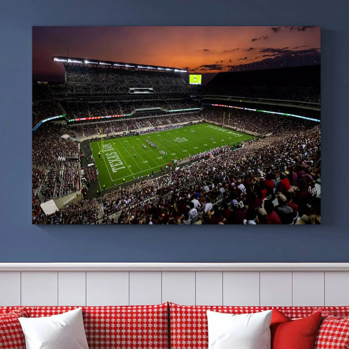 The Texas A&M University Aggies Football Team Print - College Station Kyle Field Stadium Wall Art Canvas Print captures a vibrant sunset casting a warm glow over the green field, bringing the scene to life.