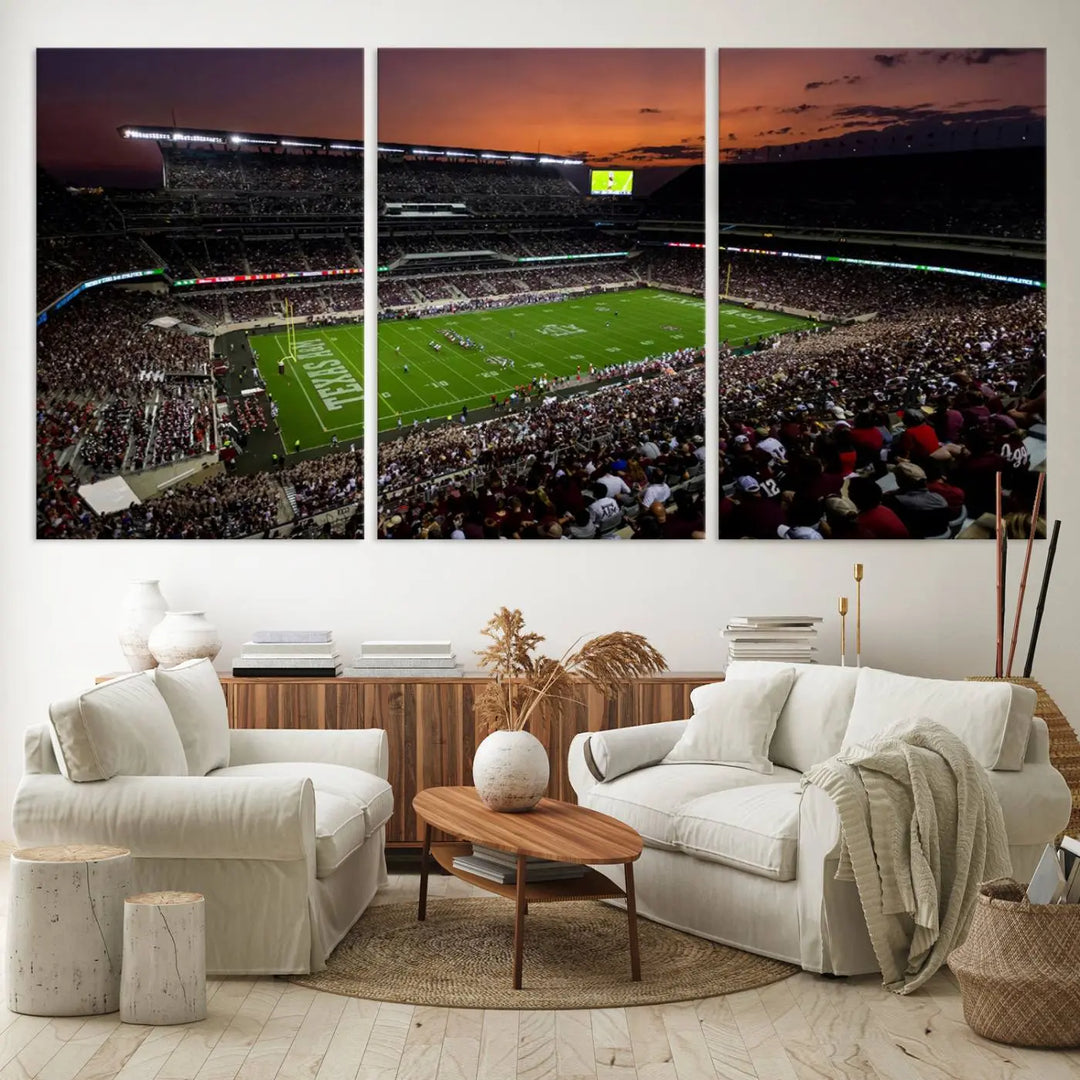 The Texas A&M University Aggies Football Team Print - College Station Kyle Field Stadium Wall Art Canvas Print captures a vibrant sunset casting a warm glow over the green field, bringing the scene to life.