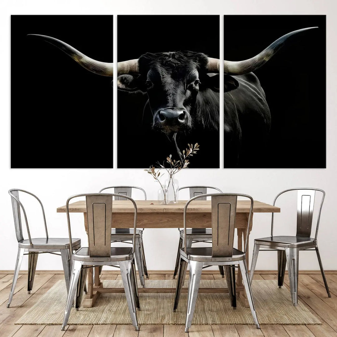 This sophisticated Texas Black Longhorn Bull Wall Art Canvas Print serves as an impressive triptych piece. The vivid depiction of the Western Texas cattle against the dark background enhances the elegance and boldness of the space.