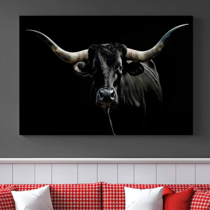 This sophisticated Texas Black Longhorn Bull Wall Art Canvas Print serves as an impressive triptych piece. The vivid depiction of the Western Texas cattle against the dark background enhances the elegance and boldness of the space.