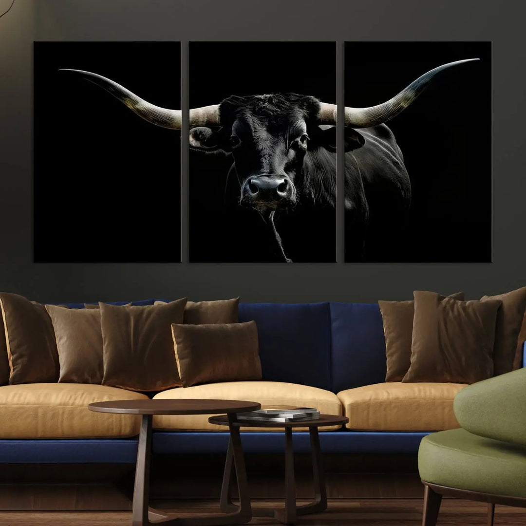 This sophisticated Texas Black Longhorn Bull Wall Art Canvas Print serves as an impressive triptych piece. The vivid depiction of the Western Texas cattle against the dark background enhances the elegance and boldness of the space.