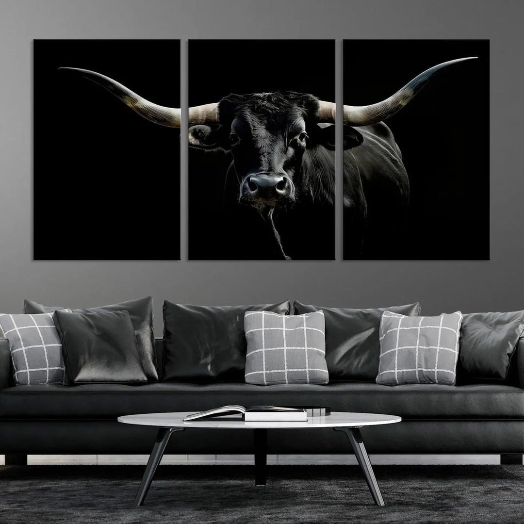 This sophisticated Texas Black Longhorn Bull Wall Art Canvas Print serves as an impressive triptych piece. The vivid depiction of the Western Texas cattle against the dark background enhances the elegance and boldness of the space.