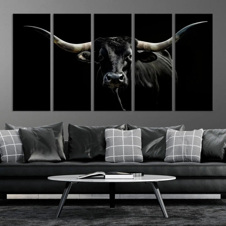 This sophisticated Texas Black Longhorn Bull Wall Art Canvas Print serves as an impressive triptych piece. The vivid depiction of the Western Texas cattle against the dark background enhances the elegance and boldness of the space.