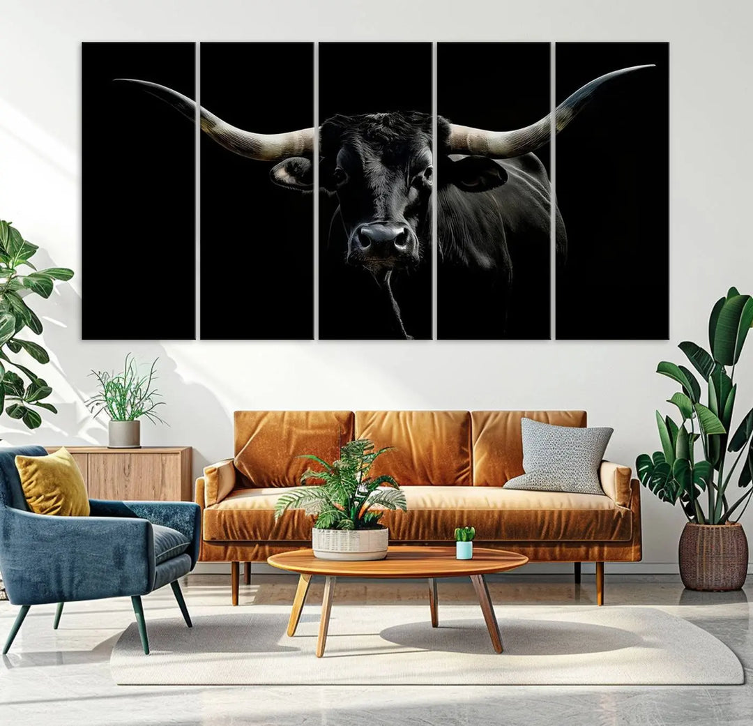 This sophisticated Texas Black Longhorn Bull Wall Art Canvas Print serves as an impressive triptych piece. The vivid depiction of the Western Texas cattle against the dark background enhances the elegance and boldness of the space.