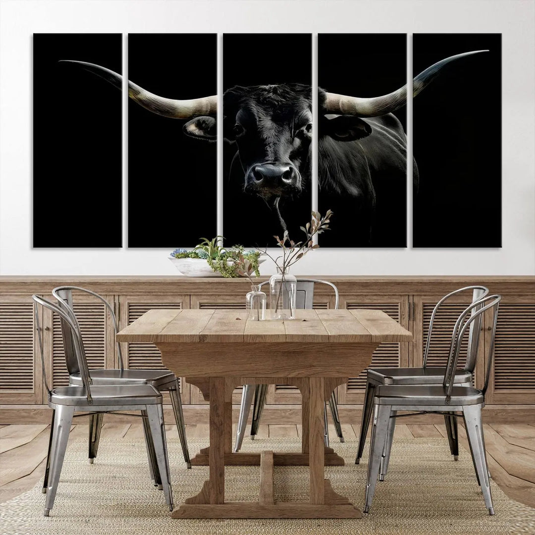 This sophisticated Texas Black Longhorn Bull Wall Art Canvas Print serves as an impressive triptych piece. The vivid depiction of the Western Texas cattle against the dark background enhances the elegance and boldness of the space.