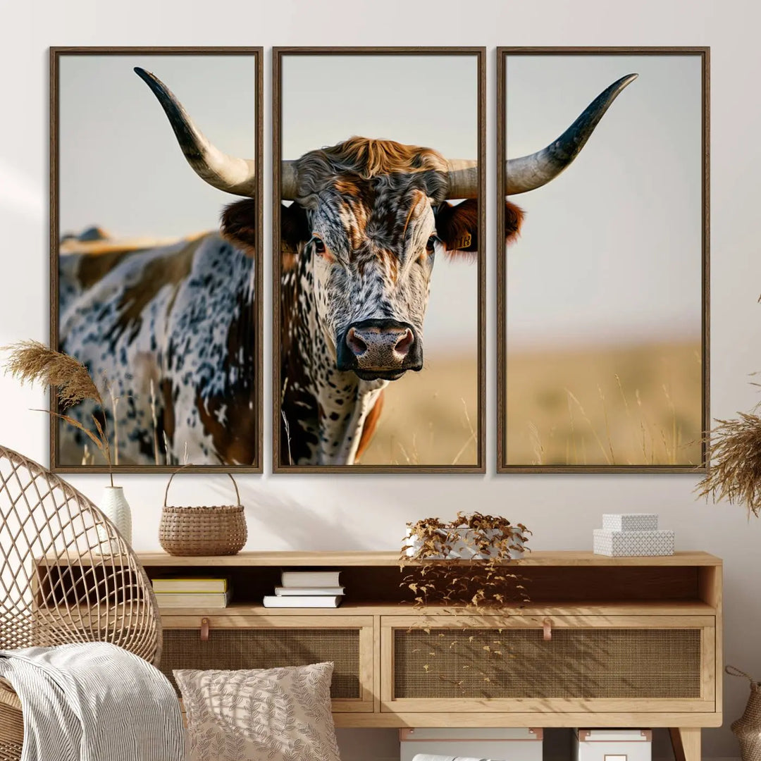 A triptych of Texas Bull Longhorn canvas prints adorns the wall.