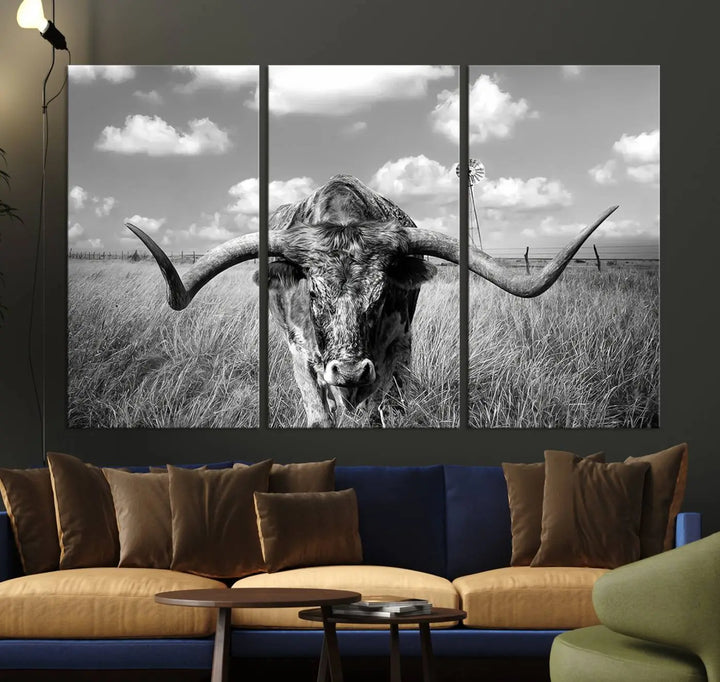 The Texas Cow Longhorn Wall Art Canvas Print features a black and white triptych of a longhorn steer in a grassy field, rendered with high-resolution clarity on museum quality canvas.