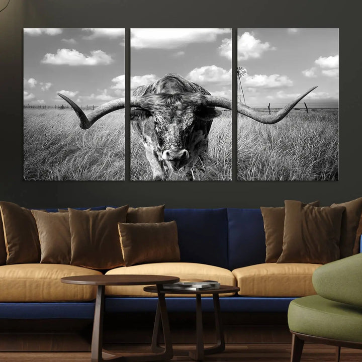 The Texas Cow Longhorn Wall Art Canvas Print features a black and white triptych of a longhorn steer in a grassy field, rendered with high-resolution clarity on museum quality canvas.