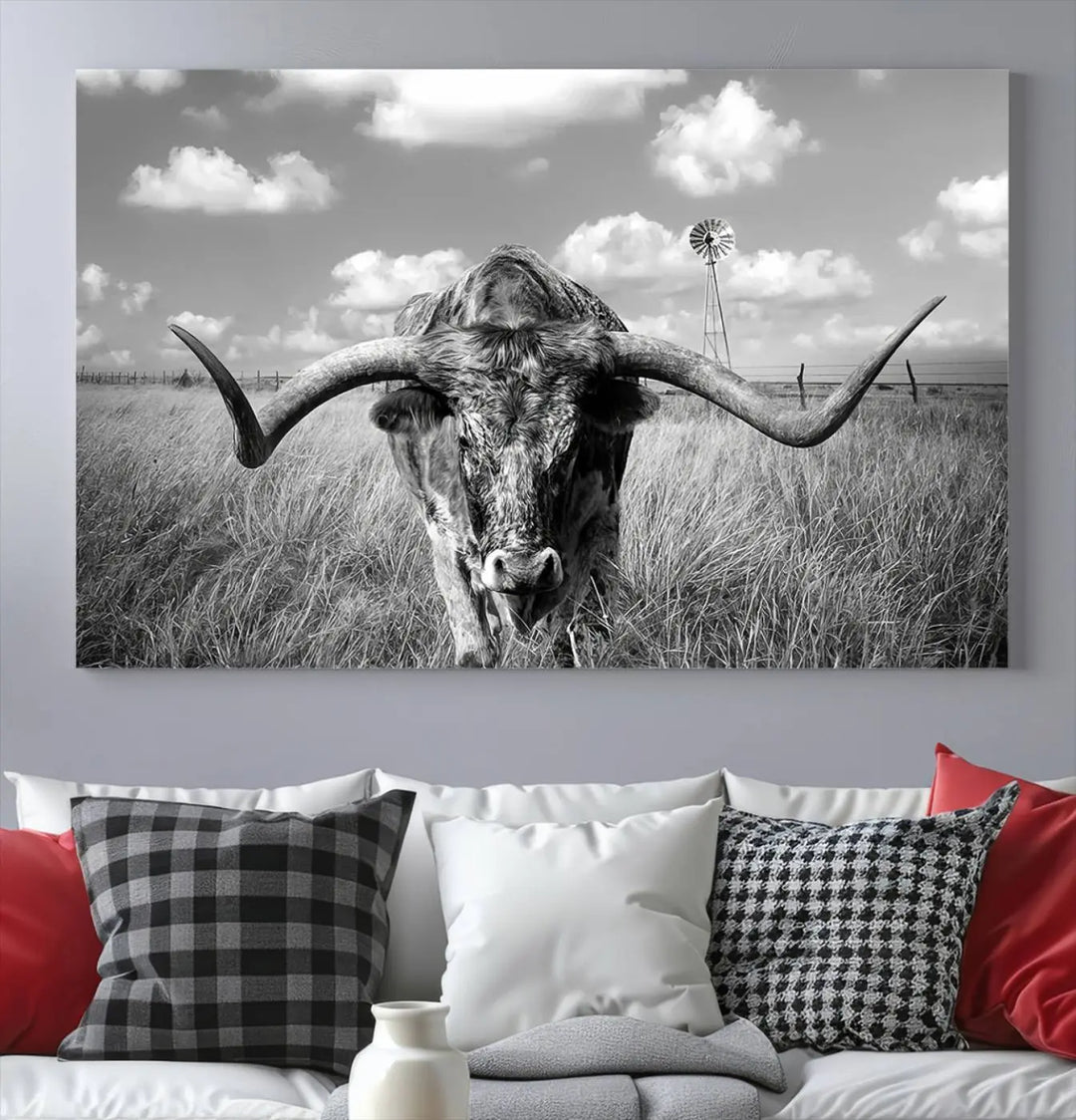 The Texas Cow Longhorn Wall Art Canvas Print features a black and white triptych of a longhorn steer in a grassy field, rendered with high-resolution clarity on museum quality canvas.