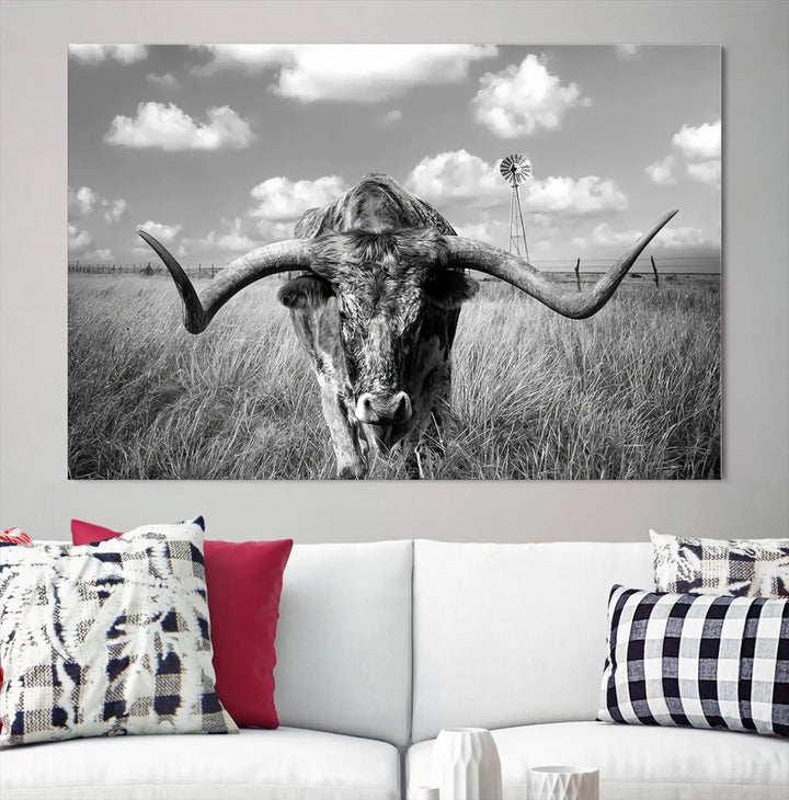 The Texas Cow Longhorn Wall Art Canvas Print features a black and white triptych of a longhorn steer in a grassy field, rendered with high-resolution clarity on museum quality canvas.