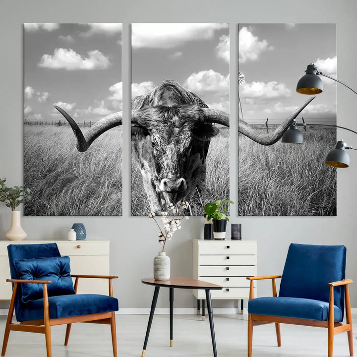 The Texas Cow Longhorn Wall Art Canvas Print features a black and white triptych of a longhorn steer in a grassy field, rendered with high-resolution clarity on museum quality canvas.