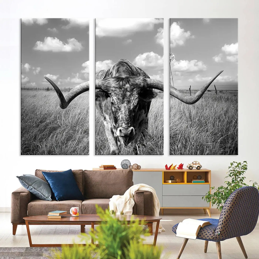 The Texas Cow Longhorn Wall Art Canvas Print features a black and white triptych of a longhorn steer in a grassy field, rendered with high-resolution clarity on museum quality canvas.