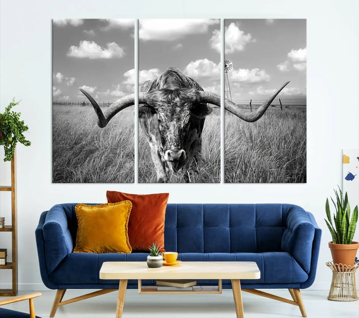 The Texas Cow Longhorn Wall Art Canvas Print features a black and white triptych of a longhorn steer in a grassy field, rendered with high-resolution clarity on museum quality canvas.