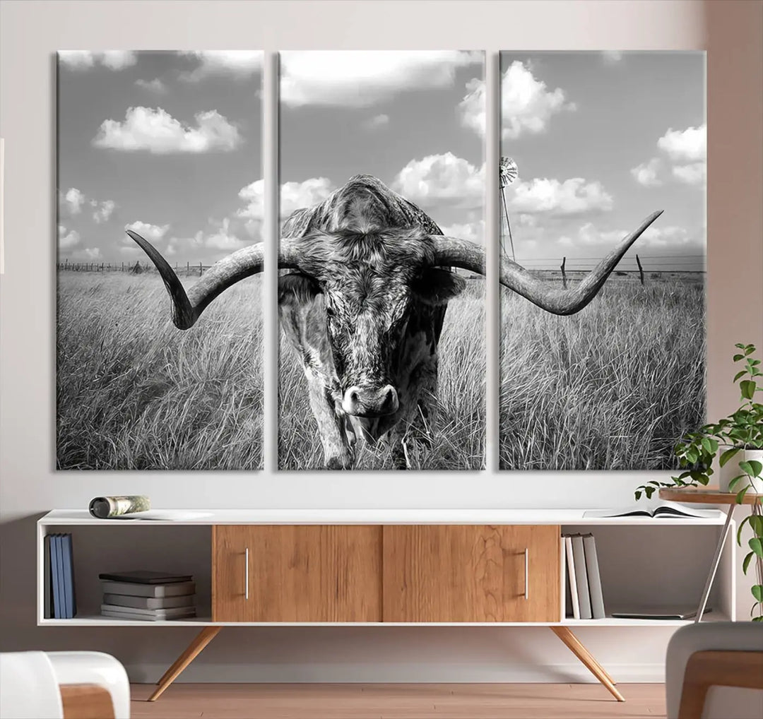 The Texas Cow Longhorn Wall Art Canvas Print features a black and white triptych of a longhorn steer in a grassy field, rendered with high-resolution clarity on museum quality canvas.