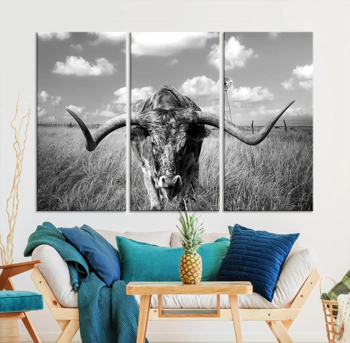 The Texas Cow Longhorn Wall Art Canvas Print features a black and white triptych of a longhorn steer in a grassy field, rendered with high-resolution clarity on museum quality canvas.