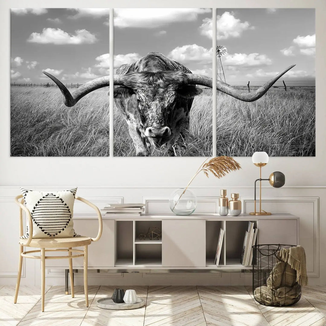 The Texas Cow Longhorn Wall Art Canvas Print features a black and white triptych of a longhorn steer in a grassy field, rendered with high-resolution clarity on museum quality canvas.