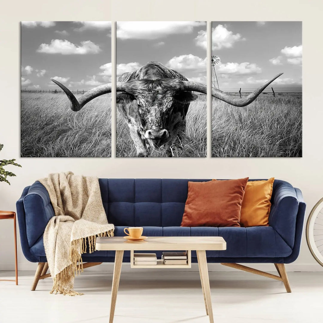 The Texas Cow Longhorn Wall Art Canvas Print features a black and white triptych of a longhorn steer in a grassy field, rendered with high-resolution clarity on museum quality canvas.