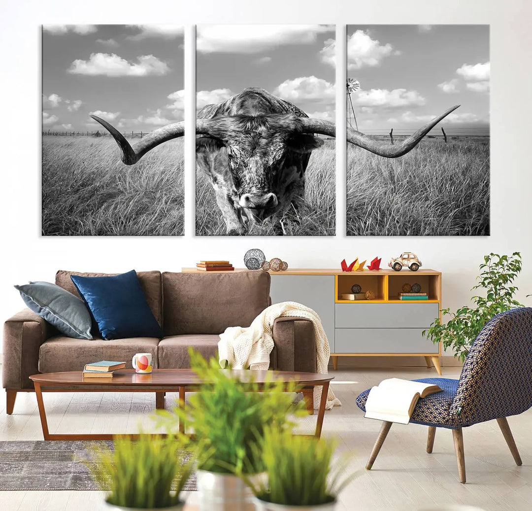 The Texas Cow Longhorn Wall Art Canvas Print features a black and white triptych of a longhorn steer in a grassy field, rendered with high-resolution clarity on museum quality canvas.