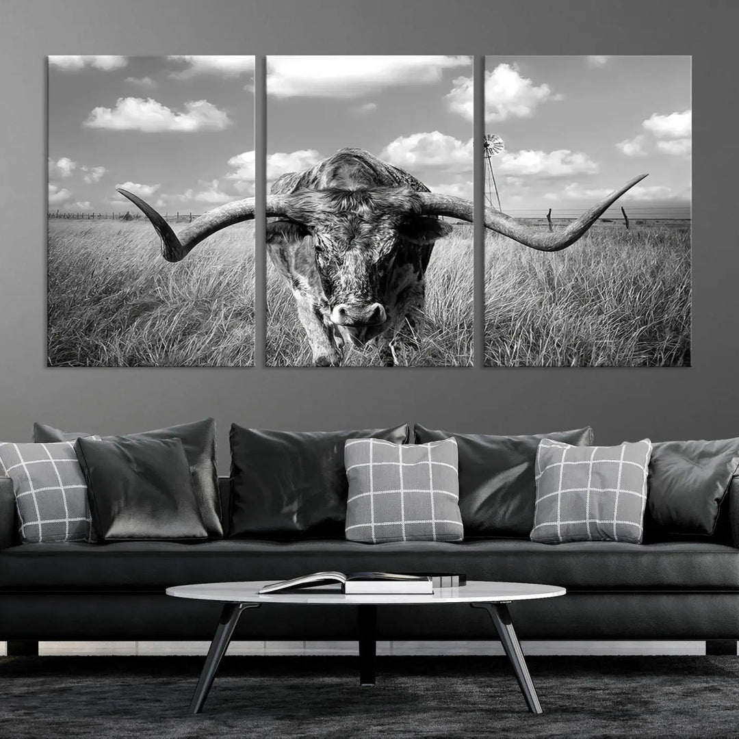 The Texas Cow Longhorn Wall Art Canvas Print features a black and white triptych of a longhorn steer in a grassy field, rendered with high-resolution clarity on museum quality canvas.