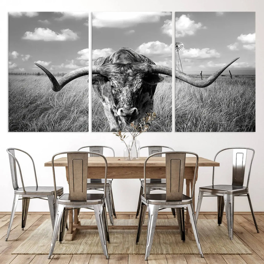 The Texas Cow Longhorn Wall Art Canvas Print features a black and white triptych of a longhorn steer in a grassy field, rendered with high-resolution clarity on museum quality canvas.