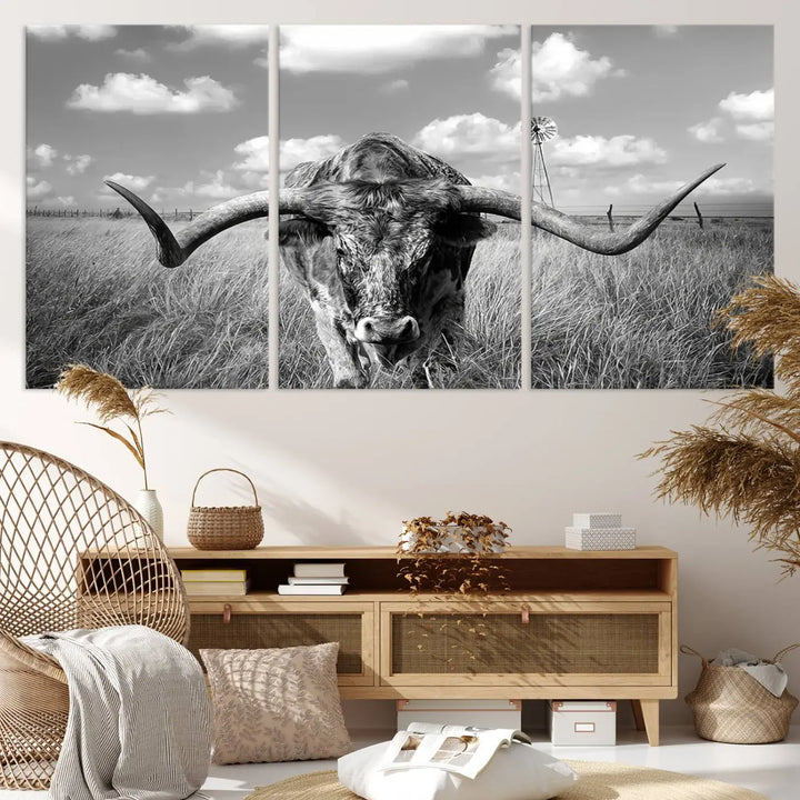 The Texas Cow Longhorn Wall Art Canvas Print features a black and white triptych of a longhorn steer in a grassy field, rendered with high-resolution clarity on museum quality canvas.