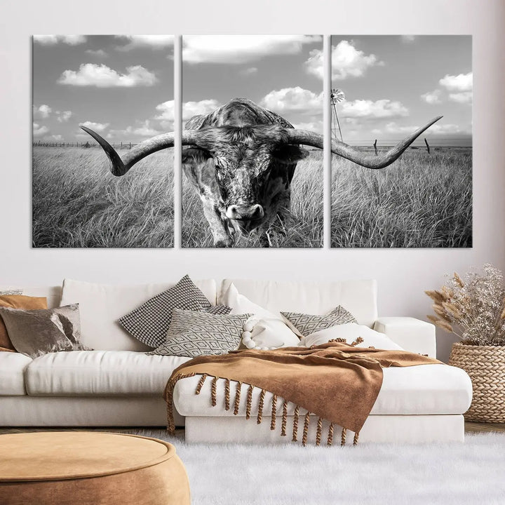 The Texas Cow Longhorn Wall Art Canvas Print features a black and white triptych of a longhorn steer in a grassy field, rendered with high-resolution clarity on museum quality canvas.