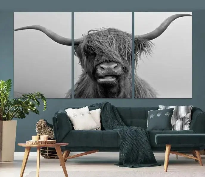 Texas Cow Wall Art Canvas Print in black and white, featuring a long-horned Highland cow, printed on museum-quality canvas with UV protection. It's perfect for enhancing any sophisticated space.