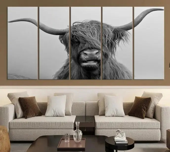 Texas Cow Wall Art Canvas Print in black and white, featuring a long-horned Highland cow, printed on museum-quality canvas with UV protection. It's perfect for enhancing any sophisticated space.